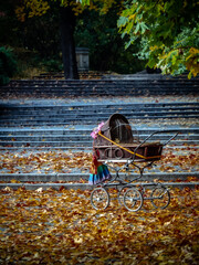 Classic stroller on an autumn day in the park © Piotr