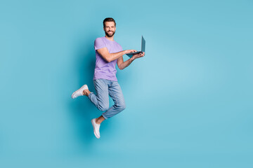 Full length body size photo of cheerful jumping student studying with computer smiling isolated on...