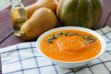 Close up photo of pureed pumpkin soup with pumpkin seeds