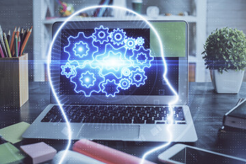 Fototapeta premium Double exposure of desktop computer and human brain drawing hologram. Ai concept.