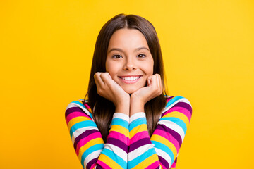 Photo of small girl two arms face cheeks toothy beaming smiling wear striped shirt isolated yellow...