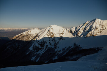 Naklejka premium Beautiful panorama of snowy European Alps in sunny day.