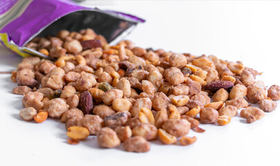 closed up of mixed assortment roasted peanut, cashew, pecan hazelnut a snack fruits, isolated on white background for texting.   