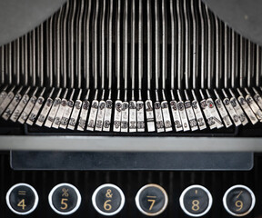 Old typewriter mechanism close up. Numbers from 4 to 9