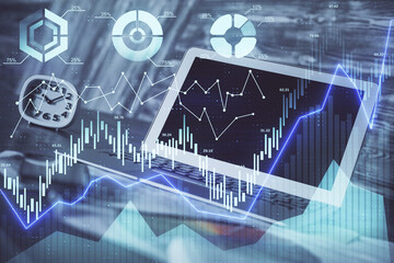 Forex market graph hologram and personal computer on background. Multi exposure. Concept of investment.