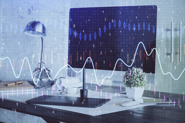 Financial graph colorful drawing and table with computer on background. Double exposure. Concept of international markets.