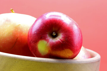 organic fresh red apple in a bowl