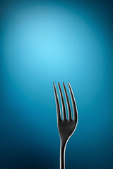 Fork on a blue background