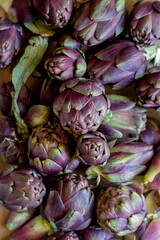 Some artichoke on a wooden background