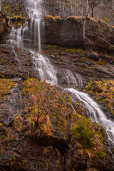 Obraz premium Romkerhalle Waterfall at Romkeklippe. High scenic waterfall near Goslar at Harz Mountains National Park, Germany