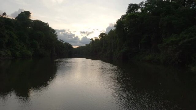Sunset over the river on the Amazonian forest