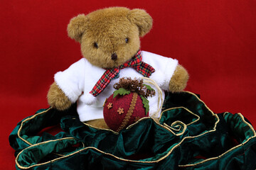 Teddy bear with gift, Vintage Christmas Tree Hanging Ball, Red Background