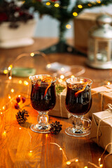 Two glass mugs of glintwine with craft presents