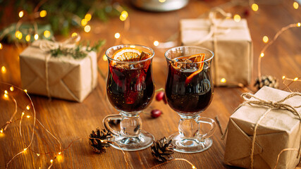 Two glass mugs of glintwine with craft presents
