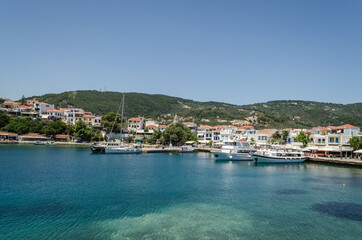 Fototapeta na wymiar Evia island, Greece - June 28. 2020: Panorama of the tourist island of Skiathos in Greece