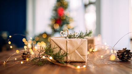 Craft wrapped present box on the wooden table