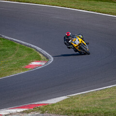 A shot of a racing bike cornering on a track.