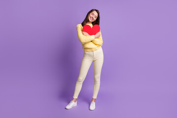 Full length body size photo of nice girlfriend embracing big red paper heart postcard for valentine day isolated on vibrant violet color background