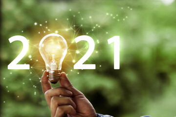 Hand hold light bulb, Idea of 2021 or new trend concept