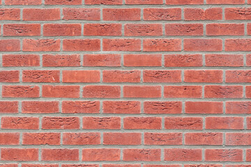 Fototapeta premium Red brick wall front view. background replacement