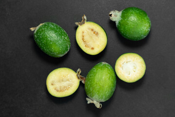 Feijoa fruits on black background. Tropical ripe feijoa fruits.