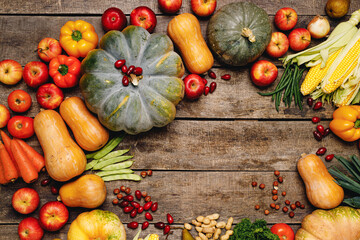 Pile of colorful fruits and vegetables on wooden background