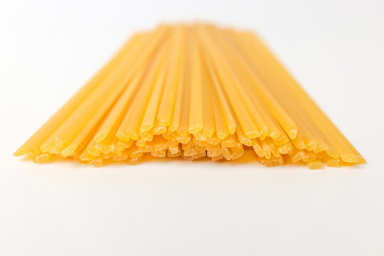 Linguini pasta on white background