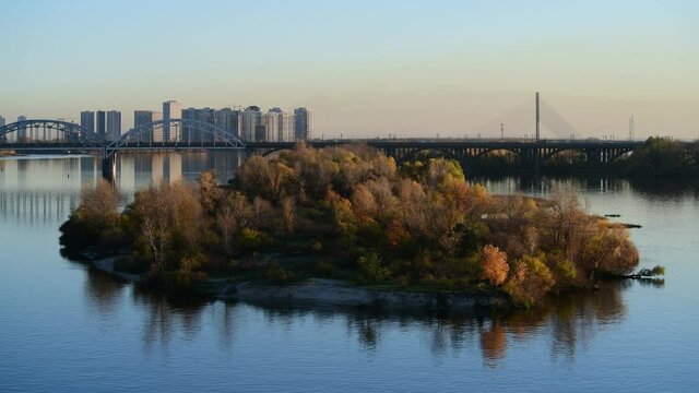 Nice evening panoramic view of Dnipro river with island Ostriv Malyy and bridge from Paton bridge in Kiev, Ukraine