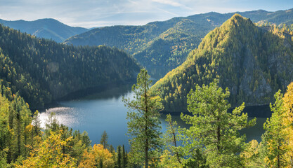 Forest Lake. Autumn landscape, sunny day. Taiga, a wild place in Siberia.