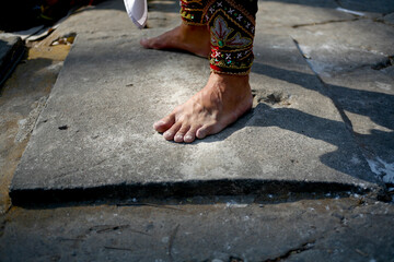 close up barefoot man