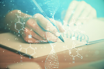 DNA theme hologram over woman's hands writing background. Concept of education. Double exposure
