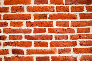 The closeup of the wreck red brickwall as a background. The texture of the brick wall. 