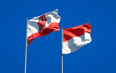 Beautiful national state flags of Gibraltar and Indonesia.