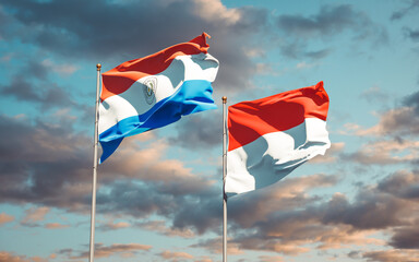 Beautiful national state flags of Paraguay and Indonesia.