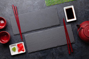 Stone plates and chopsticks for your sushi and maki © evgeeenius