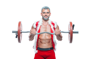 Naklejka premium Sexy Santa Claus. Bodybuilder young handsome santa clause smile train muscles arms and biceps at New Years eve and Christmas winter holiday white background.
