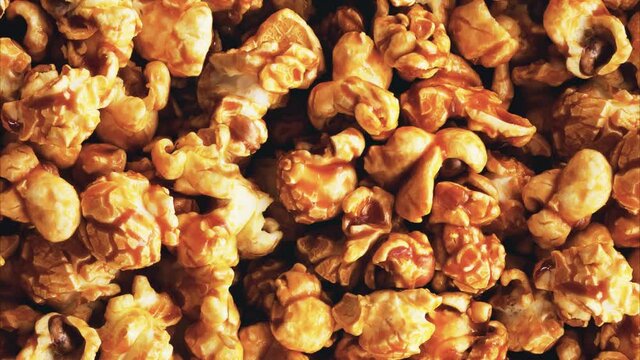 Pile of spinning caramel popcorn. View from above.