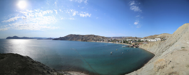 seashore sandwiched into a bay by rocks