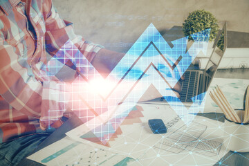 Growing arrows with businessman working on computer on background. Success concept. Double exposure.
