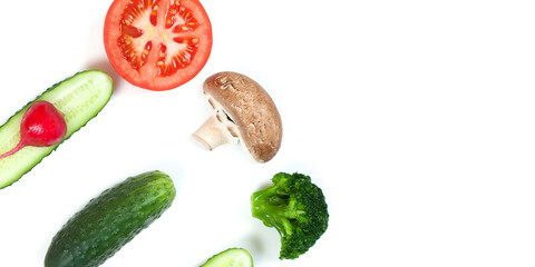 Ingredients for homemade pizza on white background. Top view. Ingredients for salad, slices mushrooms, slices tomatoes, cucumbers and broccoli. Healthy food conception