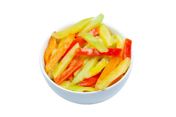 Top view of frozen varicoloured sweet sliced bell pepper in a bowl on a white background