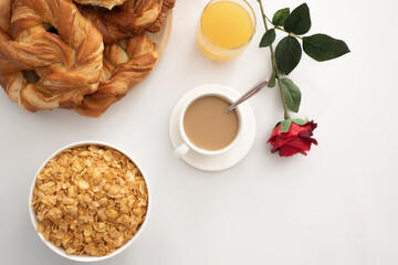 Breakfast with coffee, pastries, juice and cereals