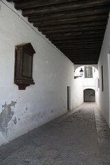 Fototapeta na wymiar A narrow street in the old part of Seville