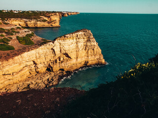 Fototapeta na wymiar Panoramic view near Carvoeiro with rocks near Lagos in Algarve, Portugal. Cliff rocks and ocean in Algarve region, Portugal. 
