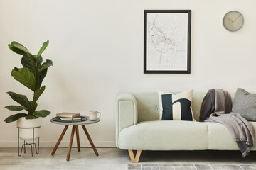 Stylish loft interior with green sofa, design pouf, mock up poster map, furniture, carpet, plants, decoration and elegant accessories. Modern home decor. Template.