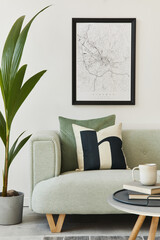 Stylish loft interior with green sofa, design pouf, mock up poster map, furniture, carpet, plants,...