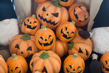 Halloween scary pumpkin with a smile in autumn park.