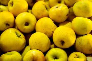yellow apples in a market
