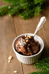 chocolate sorbet on a plate. Christmas decorations. Chocolate dessert. Chocolate ice cream balls
