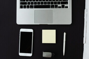 Coronavirus Covid-19 Prevention. Remote work or learning in quarantine. Laptop and antiviral medical mask, phone Notepad and pen they lie next to each other. Remote work, office work, freelance